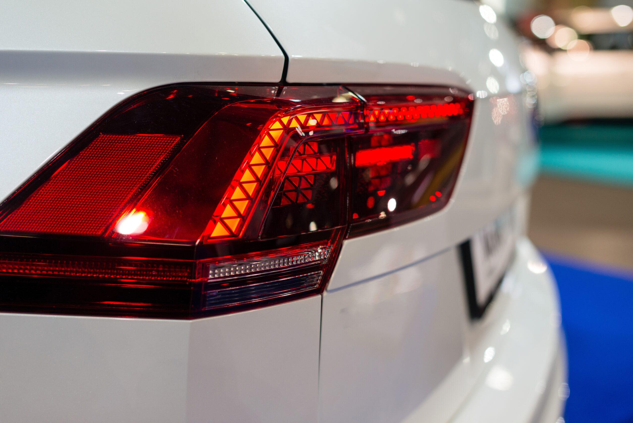 car headlight with backlight. exterior detail.white color car